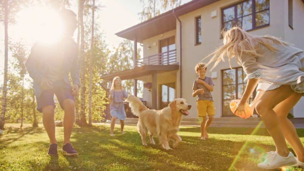 Family enjoying their home with their dog while using residential cleaning services.