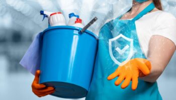 Green Angel Cleaning Services professional using eco-friendly products in a St. Louis home